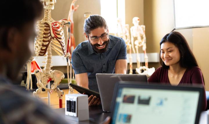 instructor with a student in the lab