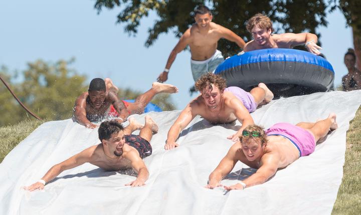 students on a slip and slide